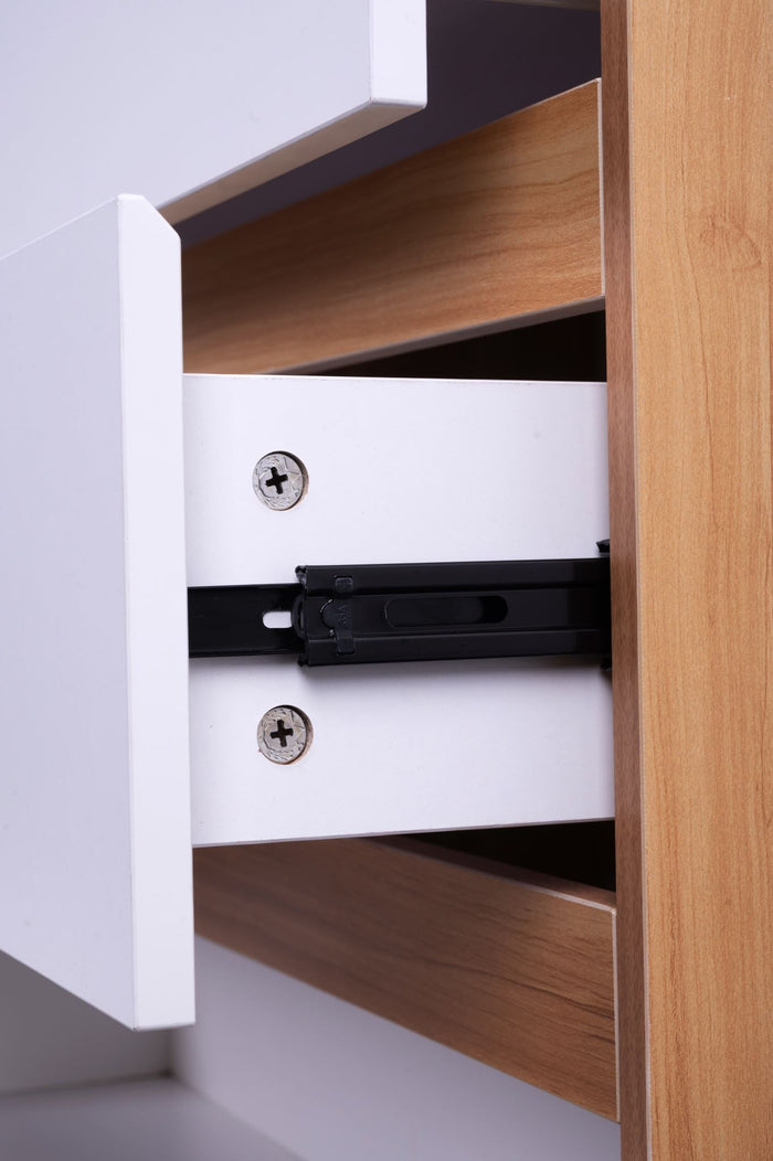 Four white and oak tall boys drawers from Sue-e Furniture's Monaco set, featuring sleek modern design with wooden accents.