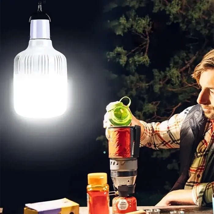 Habicare outdoor USB rechargeable LED lamp emitting bright light, compact design, suitable for outdoor use and camping.