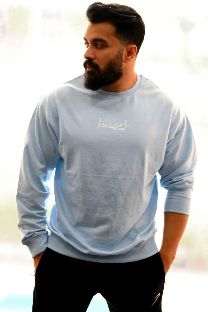 Sky blue oversized sweatshirt by Fuaark Nz, featuring a relaxed fit and soft fabric for comfortable, stylish casual wear.