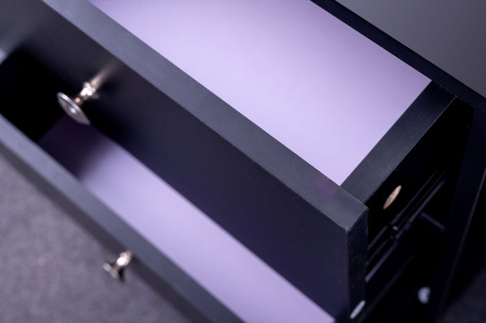 Black 'Pamela' bedside table by sue-e furniture with a sleek, modern design and a single drawer for bedroom storage.