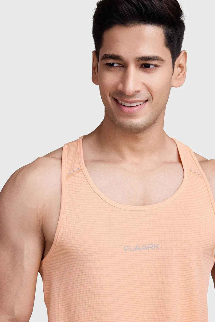Fuaark Nz peach running tank top with subtle checks, lightweight, breathable fabric, perfect for sweat-wicking comfort during workouts.