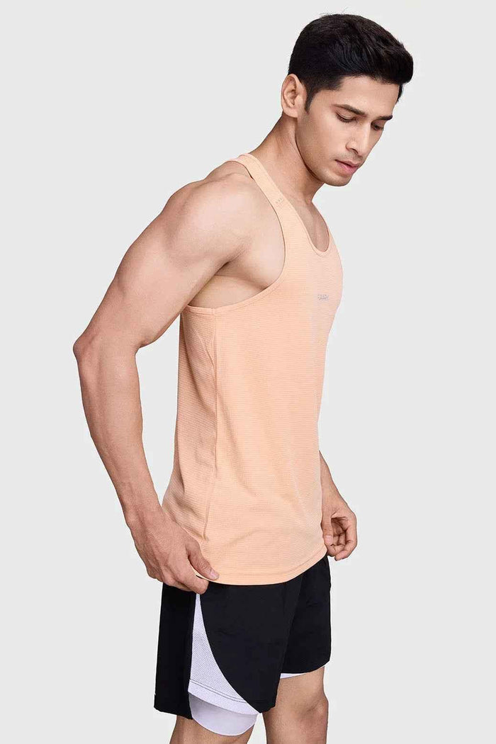 Peach Fuaark Nz running tank top with subtle checks, lightweight, breathable fabric and sweat-wicking comfort for active wear.