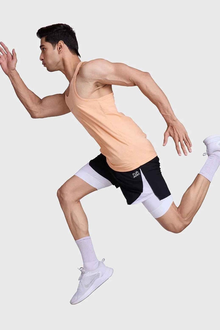 Fuaark NZ peach running tank top with subtle checks, lightweight, breathable fabric, ideal for sweat-wicking comfort during workouts.
