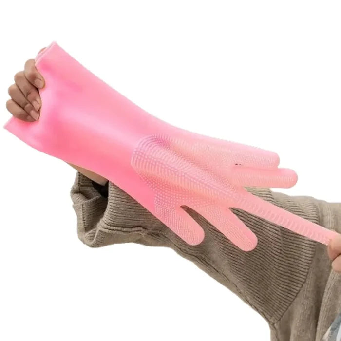 Pink and blue silicone pet grooming gloves by Habicare with textured surfaces for gentle brushing of cats and dogs.
