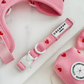 Adjustable pink cord dog collar with red heart pattern and Cocopup London branding.