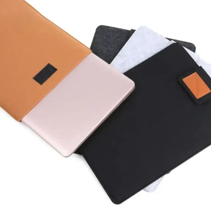 Gray felt portable laptop and tablet case from 9eight5 by Habicare, showing a slim, protective design with a zipper closure.