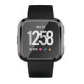 Black protective case for Fitbit Versa 1 smartwatch, designed to shield the device from scratches and impacts.