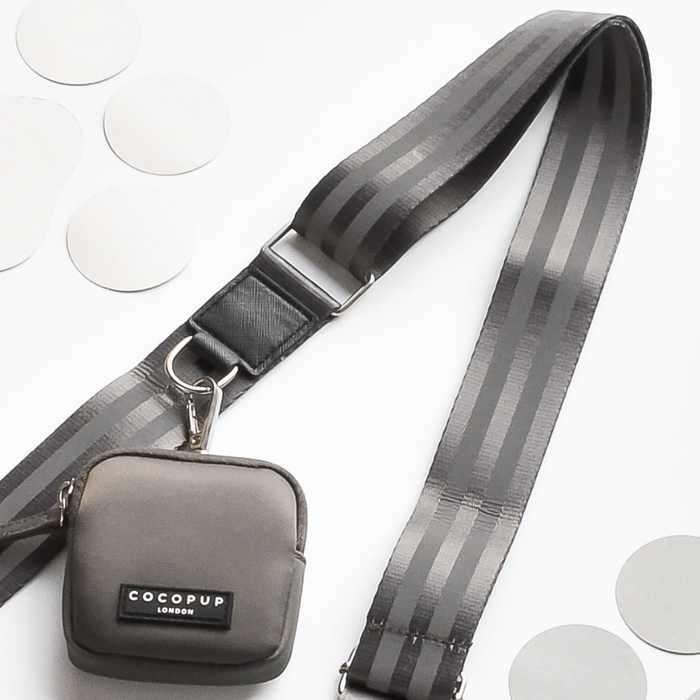 Mocha dog walking bag and matching pouch by Cocopup London, displayed on a white background with gray circles.