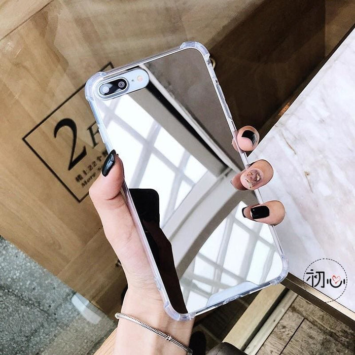 Silver mirror case for iPhone X/XS by 9eight5, showing a sleek reflective surface and precise fit for the smartphone.