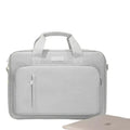 Slim Habicare 9eight5 laptop handbag designed for MacBook and Windows PCs, featuring a sleek black exterior and padded interior for protection.