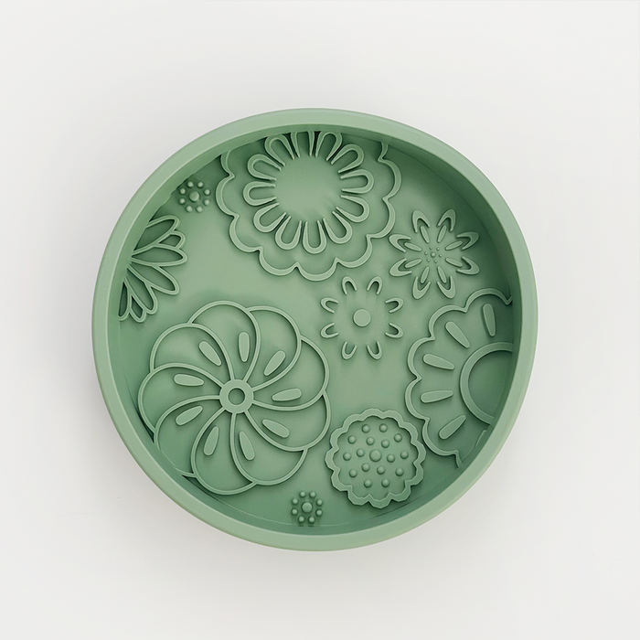 Green silicone coaster with embossed floral pattern, designed to fit Cocopup London Slow Feeder Lick Dog Bowl.