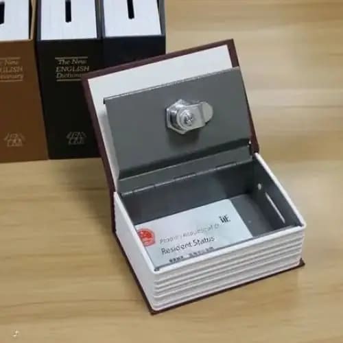 Small book-shaped safe by 9eight5, a compact lock box and money tin with a realistic book design for secure storage.