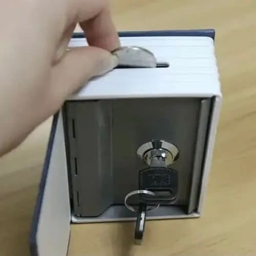 Small book-shaped safe by 9eight5, lockable money tin with hidden storage, ideal for secure cash and valuables.