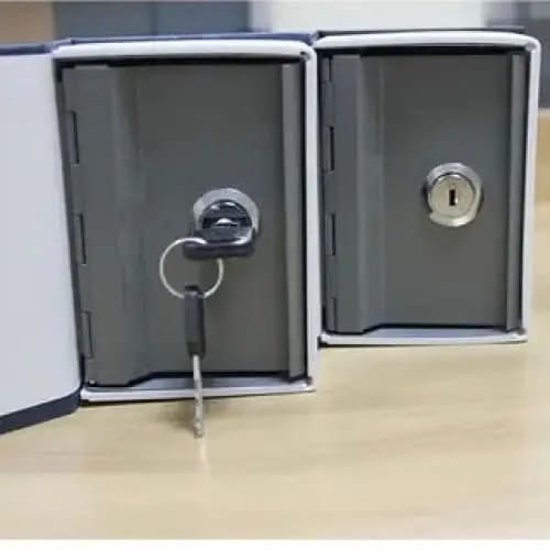 Small 9eight5 book-shaped safe with lock, used as a money tin for secure storage of valuables or cash.