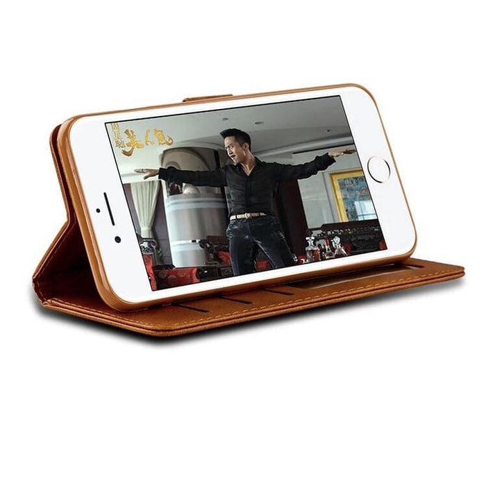 Brown synthetic leather flip case for iPhone X/XS by 9eight5, showing the front view with open flap and phone inside.