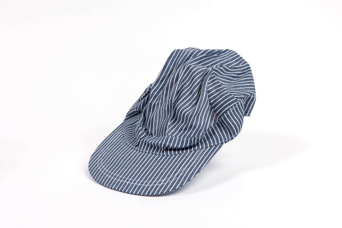 Train conductor hat included in a preschool learning kit for imaginative play