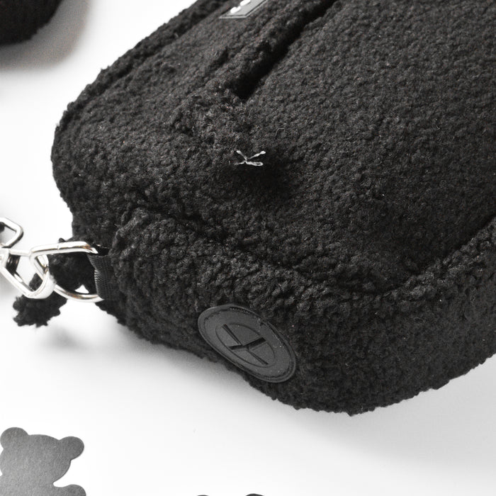 Brown plush dog treat pouch with metal clasp and round Cocopup London logo, shown in a close-up view.