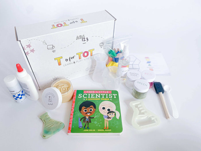 Children's Discovery Kit featuring homemade playdough and a custom flask playdough cutter. Comes with science experiment materials and pattern blocks with build-and-count laminated cards. Perfect for play-based learning and creative play.