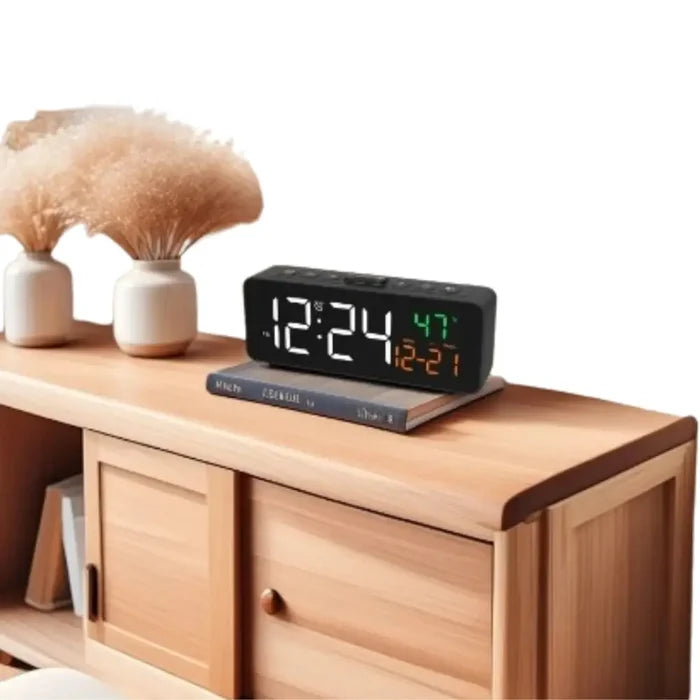 HBC Habicare USB digital alarm clock displaying temperature, date, and time with adjustable 5-level brightness.