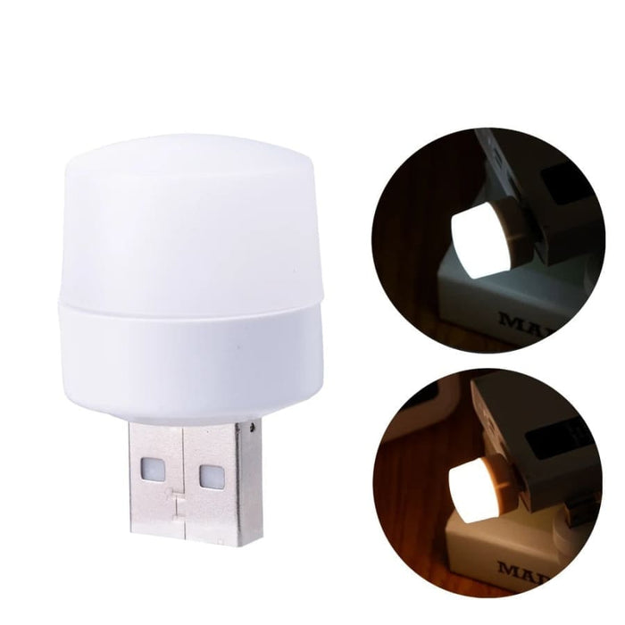 9eight5 USB night light plugged into a power outlet, providing soft illumination in a dark room.