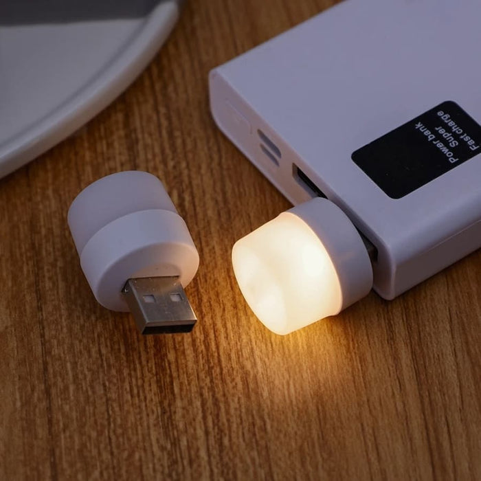 9eight5 USB night light plugged into a USB port, providing soft illumination for electronics and bedside use.