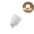 Warm white USB night light from 9eight5, compact electronic device with a sleek design for ambient bedside lighting.