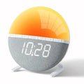 HBC Wake-Up Light Sunrise Alarm Clock by 9eight5 displaying a bright sunrise simulation and digital display on a bedside table