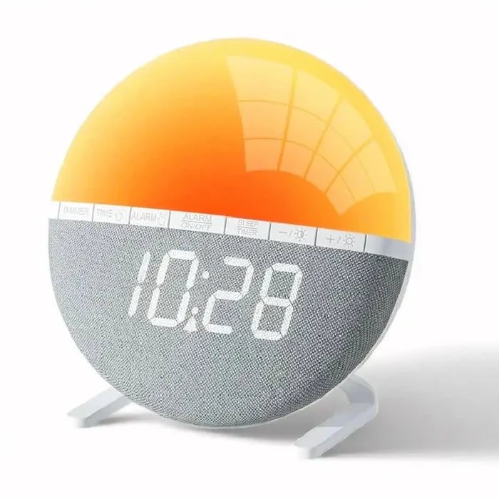 HBC Wake-Up Light Sunrise Alarm Clock by 9eight5 displaying a bright sunrise simulation and digital display on a bedside table