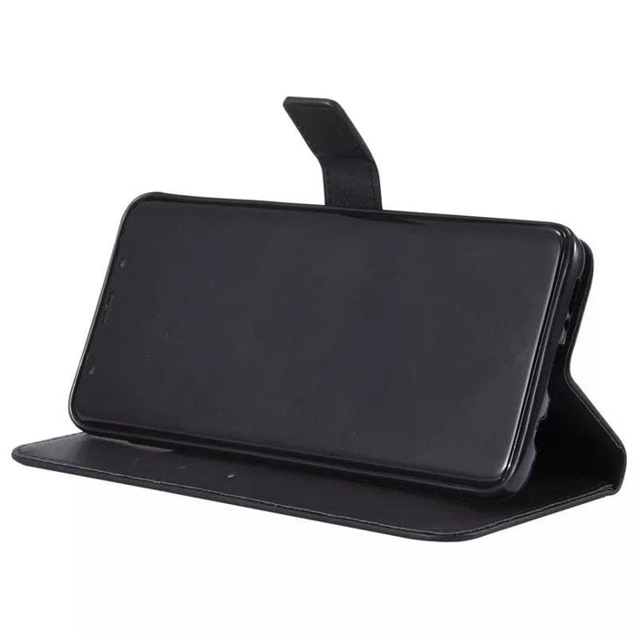 Black Samsung Galaxy S9 wallet case by 9eight5 with card slots and protective cover, designed for stylish phone protection.