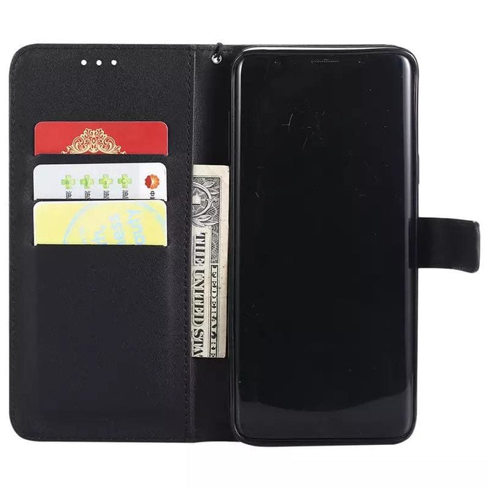 Black Samsung Galaxy S9 wallet case by 9eight5, featuring card slots and protective design, shown on the phone.