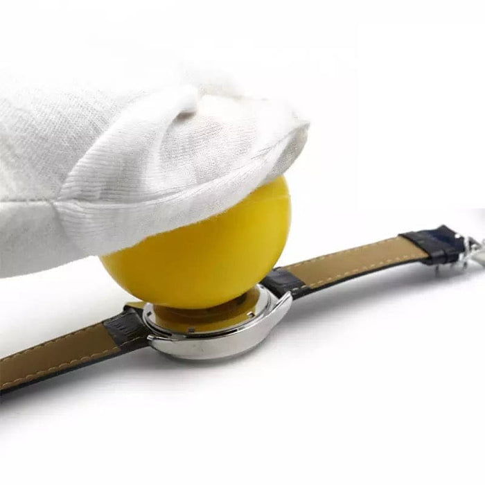 Yellow friction ball watch back cover remover tool with a person wearing a glove, used for opening watch cases.