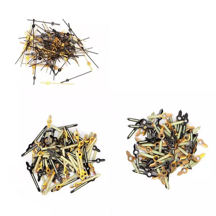 Set of 300 watch hour, minute, and second hands with screws for watch repair by That Watch Shop, displayed in a pile.