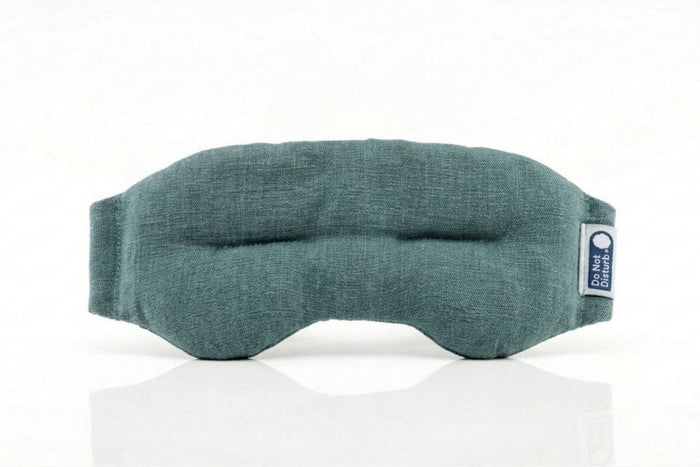 Teal weighted eye mask by Do Not Disturb Sleep Company with soft fabric and adjustable strap for relaxation and sleep comfort.