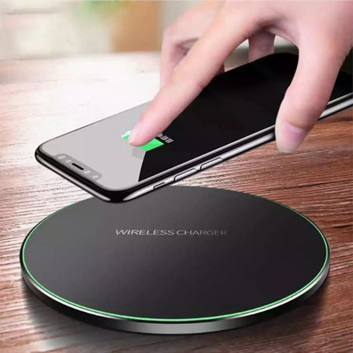 Wireless charger by 9eight5 in four colors, compatible with phones and tablets, showing sleek design and charging surface.