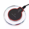 9eight5 wireless phone charger for phones and tablets, compact design, compatible with various devices, shown on a desk.